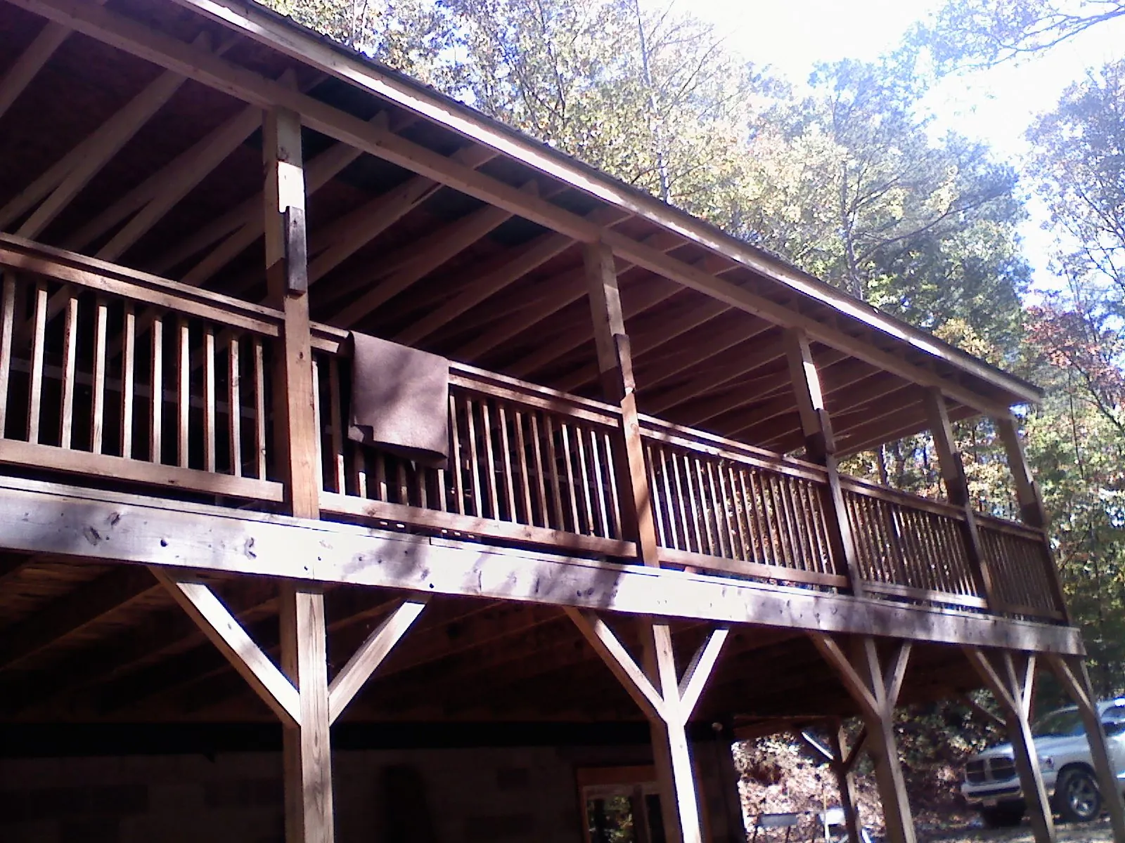 Timber framing under a new elevated porch and deck — Roof Leak Repair in Huntington Station by Roofing Brothers